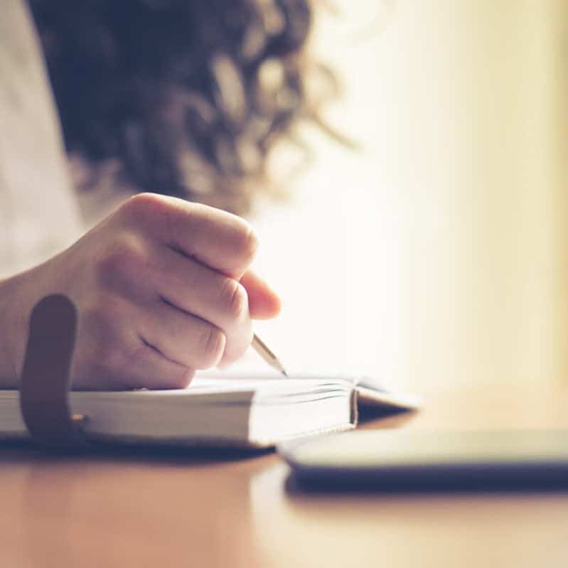 woman hand journaling