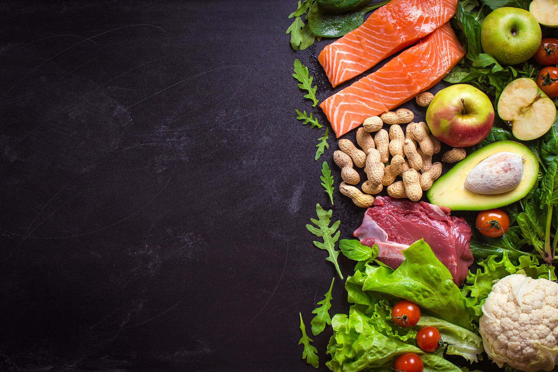 paleo food with black chalkboard background