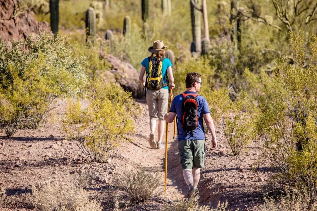 man hiking with his wife