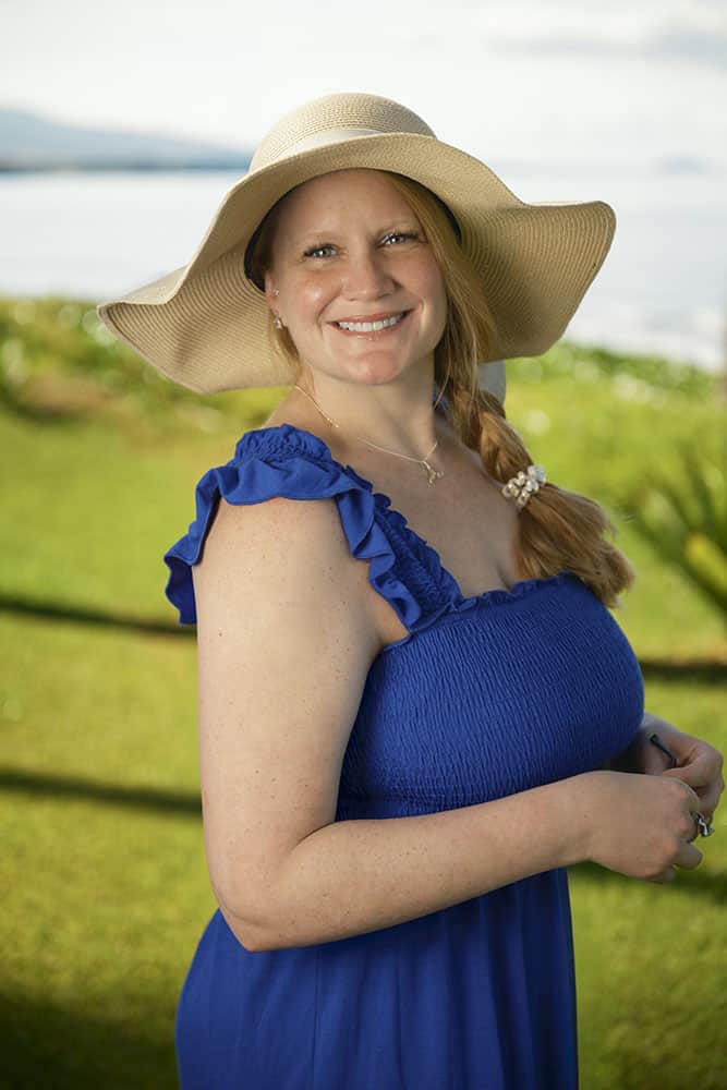 Dr. Erin West in blue sundress on Maui beach
